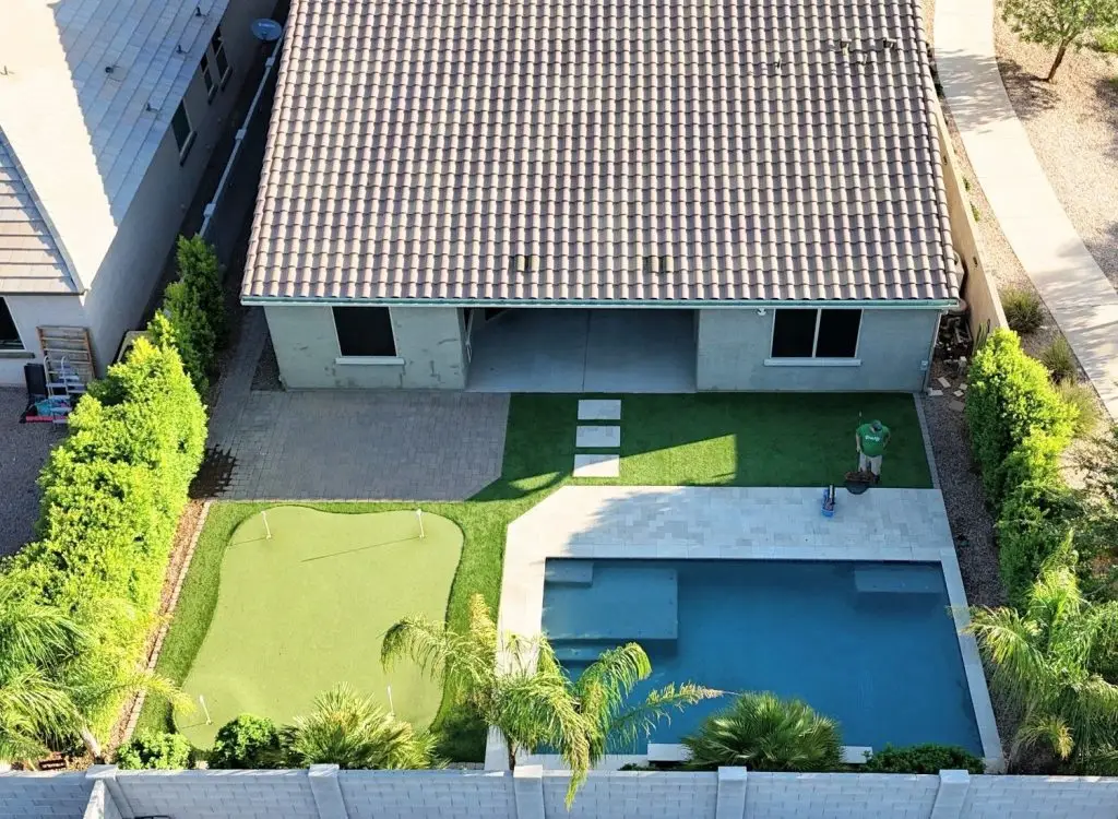 Backyard with pool and landscaping features