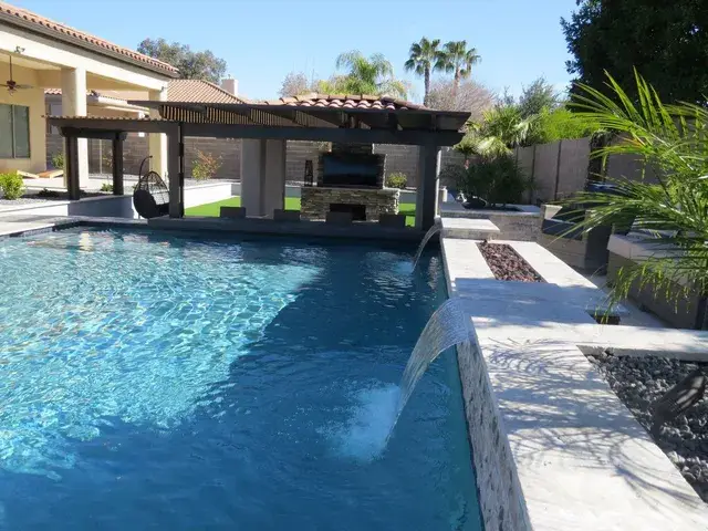 Luxury pool with waterfall feature.
