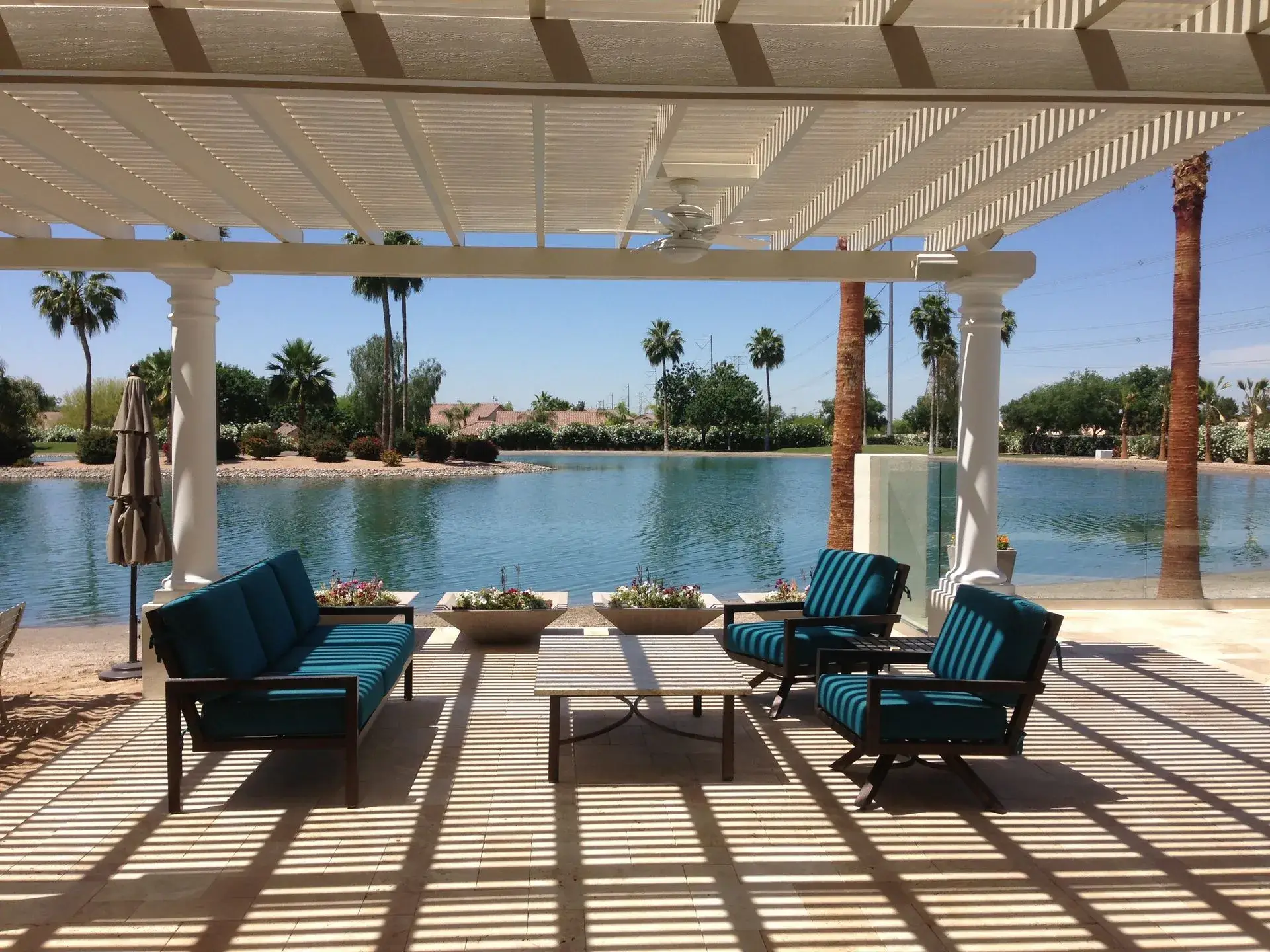Relaxing patio by a serene lake.