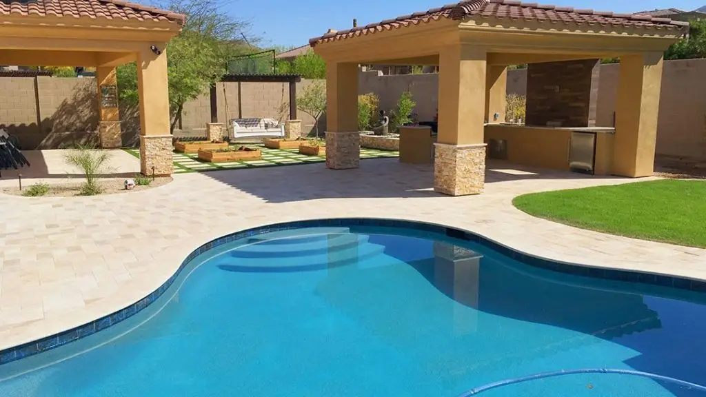 Modern pool deck with landscaping features